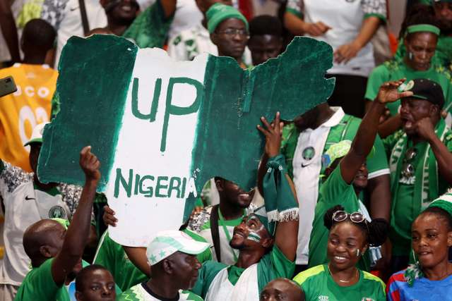 Soccer Football - Africa Cup of Nations - Semi Final - Nigeria v South Africa - Stade de la Paix, Bouake, Ivory Coast - February 7, 2024 Nigeria fans celebrate after reaching the Africa Cup of Nations final REUTERS/Siphiwe Sibeko