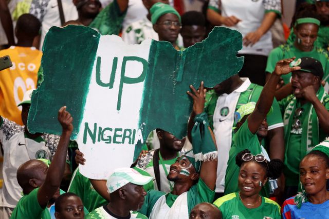 Soccer Football - Africa Cup of Nations - Semi Final - Nigeria v South Africa - Stade de la Paix, Bouake, Ivory Coast - February 7, 2024 Nigeria fans celebrate after reaching the Africa Cup of Nations final REUTERS/Siphiwe Sibeko