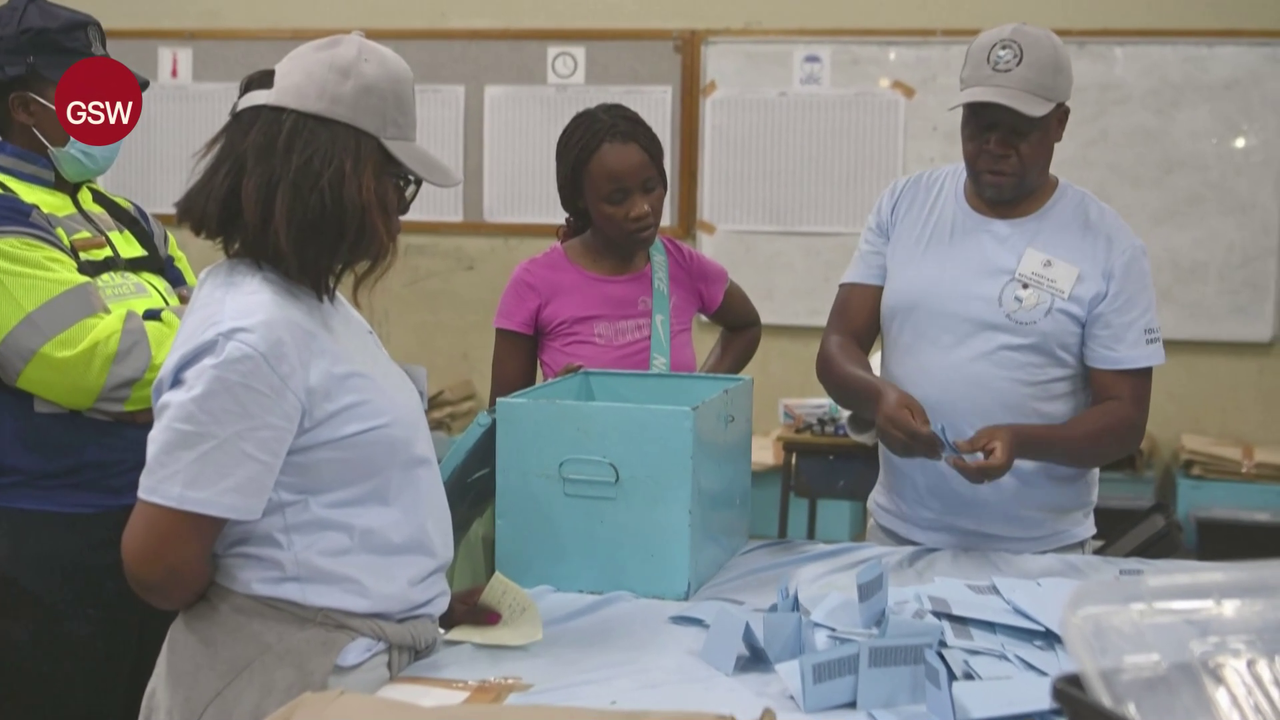 Electoral officials counting ballot papers at a counting center in Gaborone