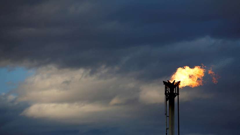 FILE PHOTO: A flare burns off excess gas from a gas plant in the Permian Basin in Loving County