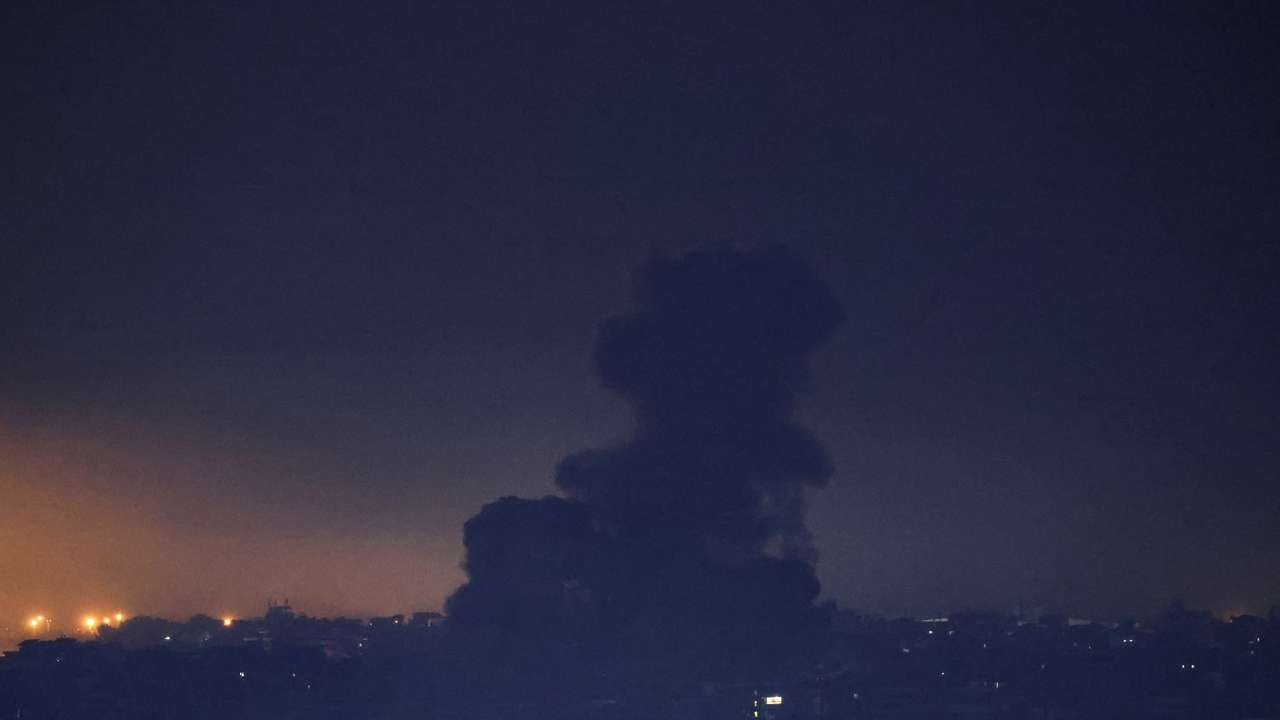 Smoke billows over Beirut southern suburbs after a strike, as seen from Sin El Fil