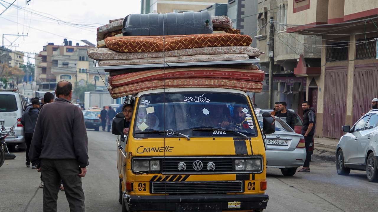 People flee the eastern parts of Rafah after the Israeli military began evacuating Palestinian civilians ahead of a threatened assault on the southern Gazan city