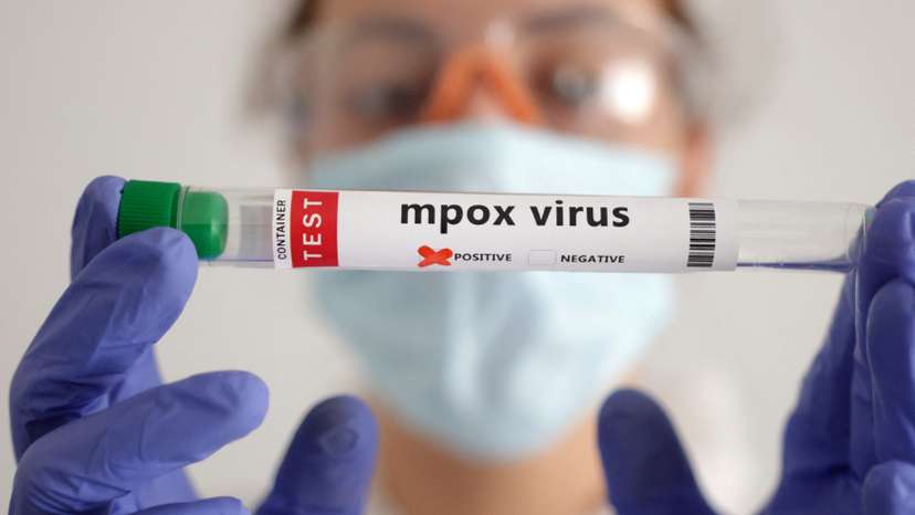 Illustration shows test tubes with "Mpox virus positive" label