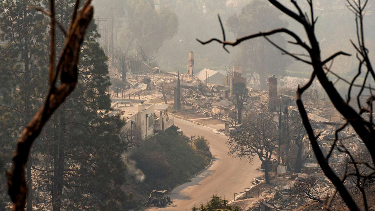 The remains of homes following the Palisades Fire in the Pacific Palisades neighborhood in Los Angeles