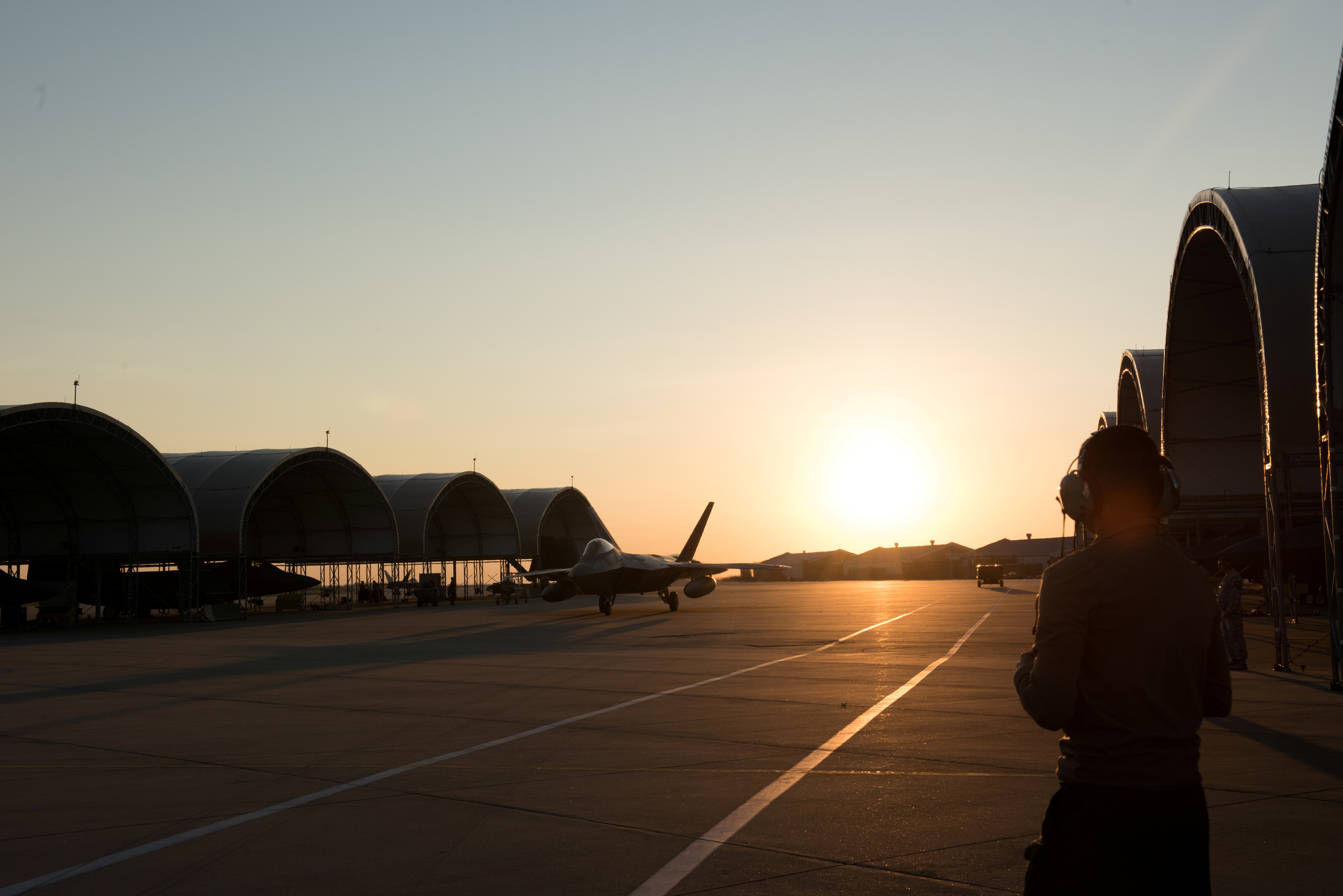 An F-22 Raptor from the 1st Fighter Wing, 27th Fighter Squadron taxis for departure deployment to Al Udeid Air Base, Qatar, from Joint Base Langley-Eustis, Virginia