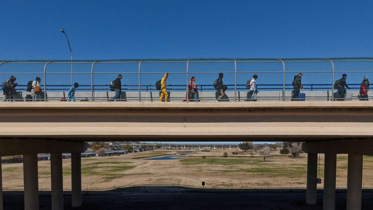 FILE PHOTO: Migrants seek asylum ahead of the inauguration of U.S. President-elect Donald Trump