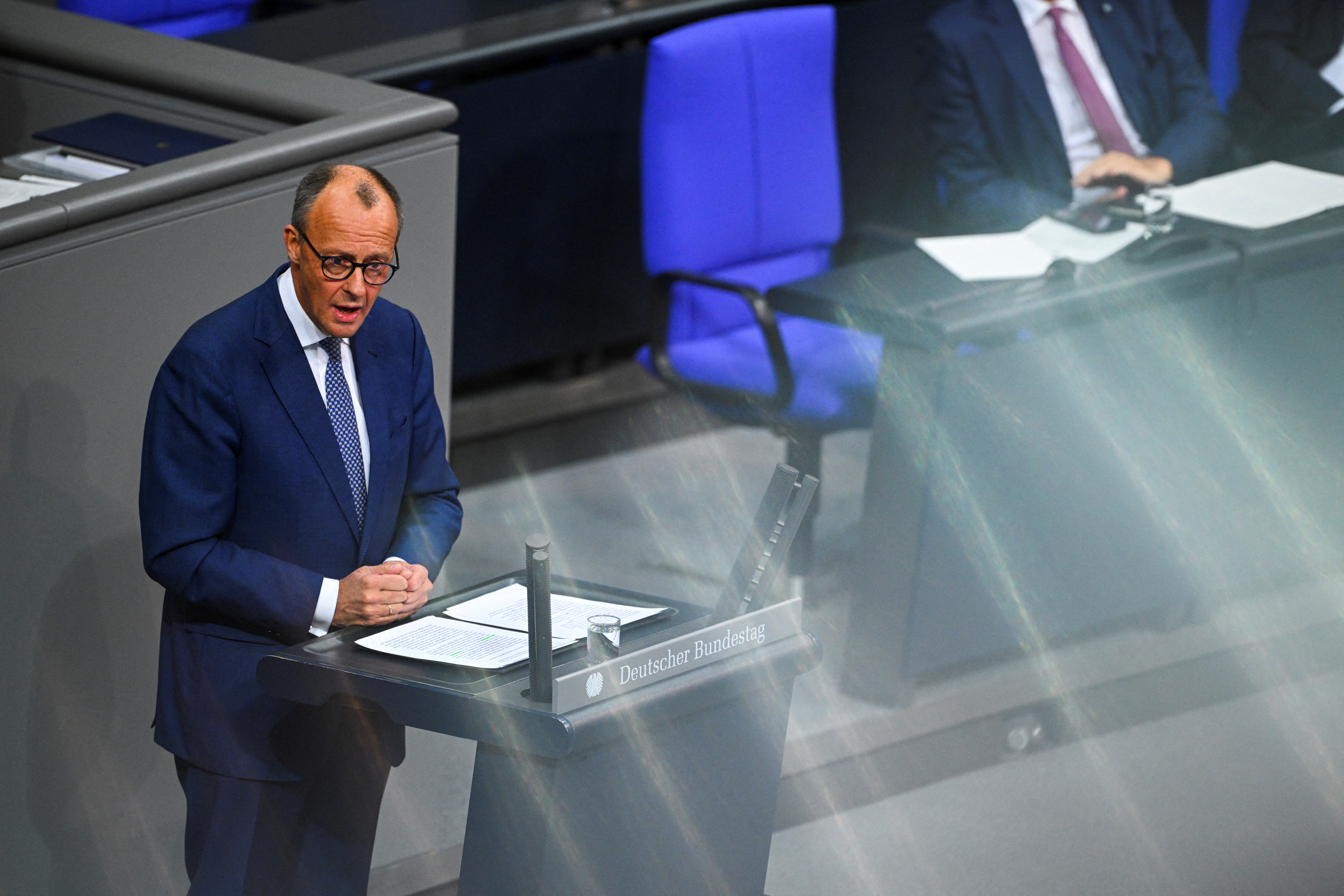 German opposition leader Friedrich Merz of the Christian Democratic Union party (CDU) addresses parliament in Berlin