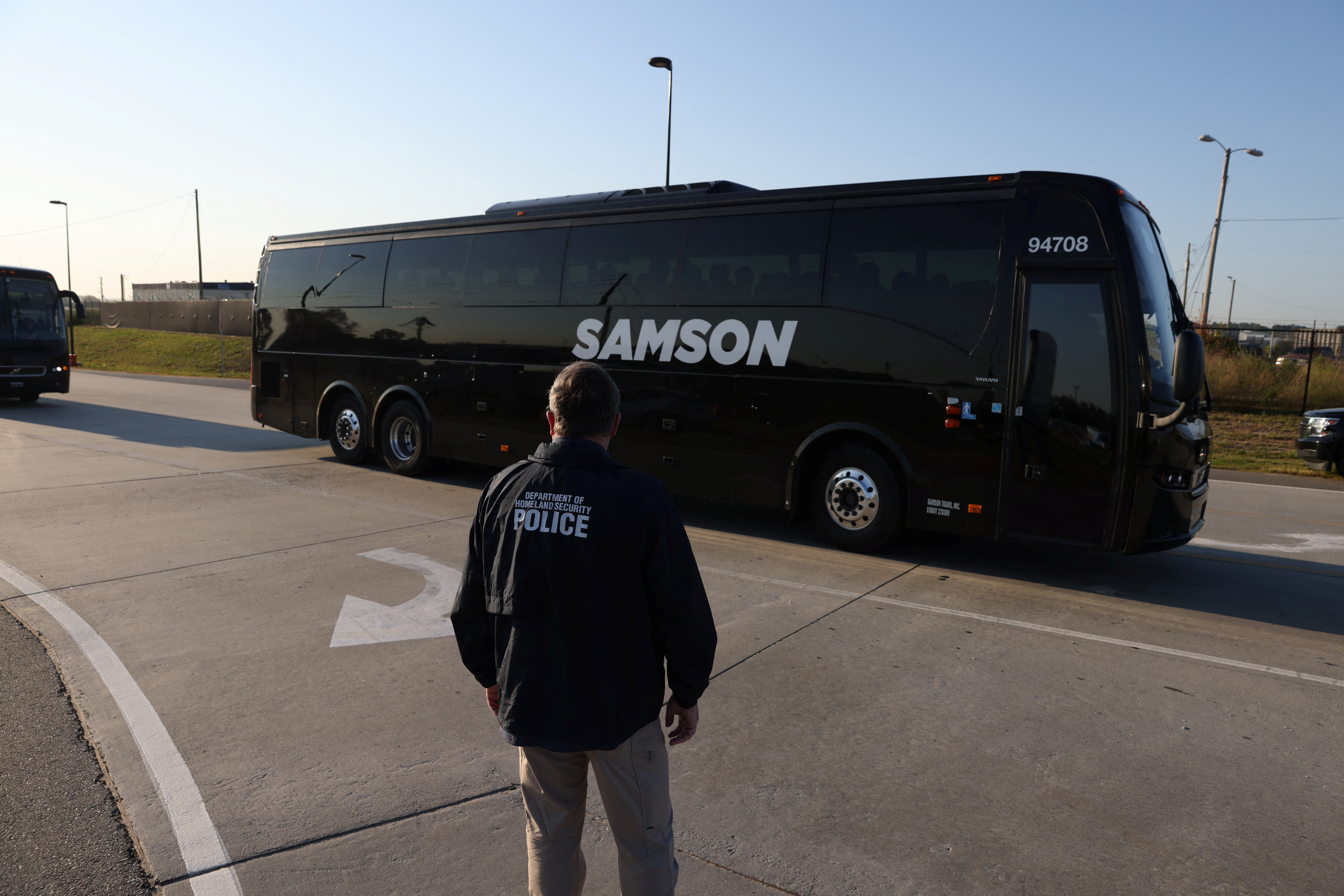 Buses transporting workers detained in a huge U.S. immigration raid last week on a car battery plant arrive at Hartsfield-Jackson Atlanta International Airport