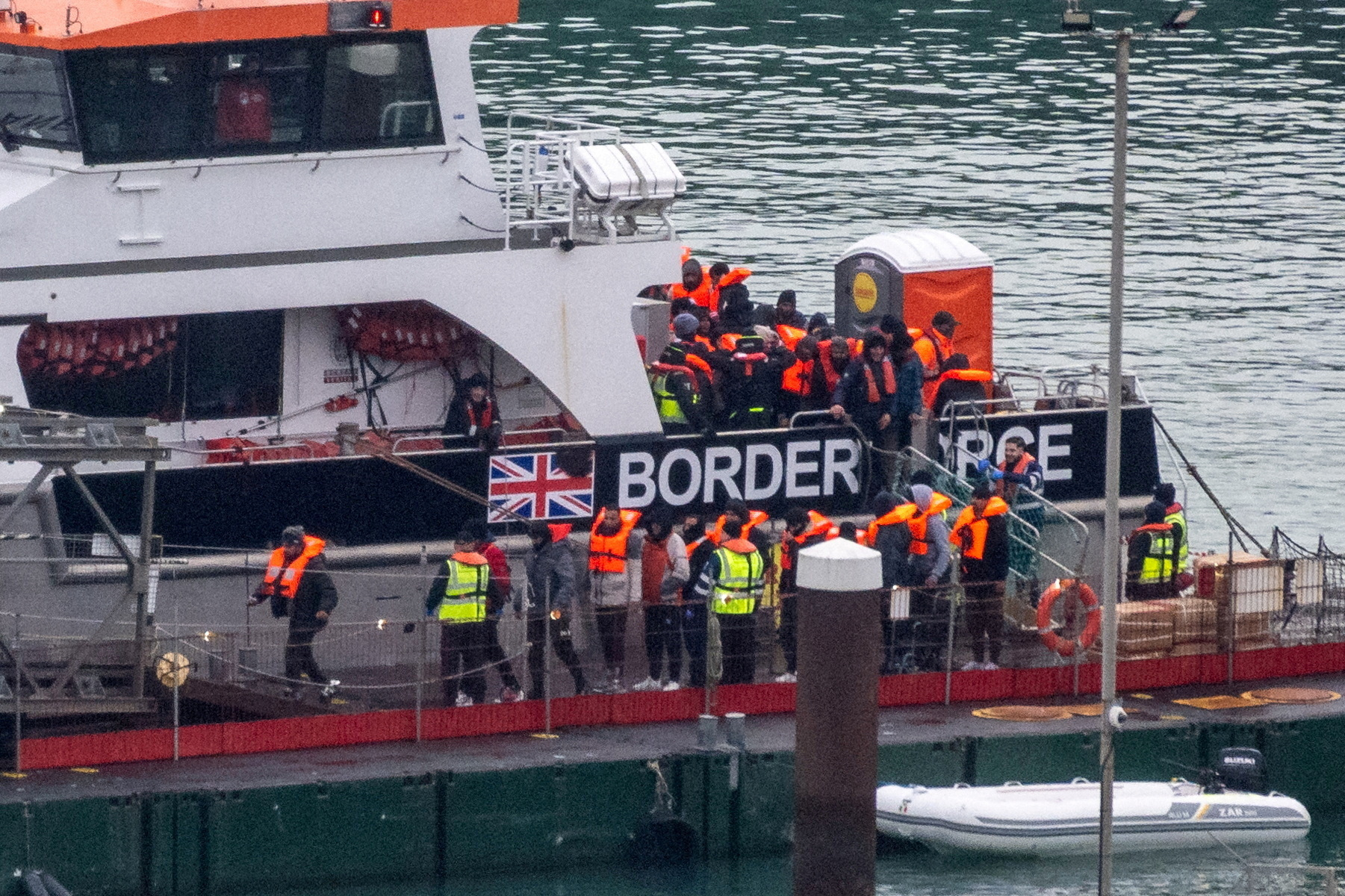 FILE PHOTO: Migrants arrive in the UK after crossing the English Channel