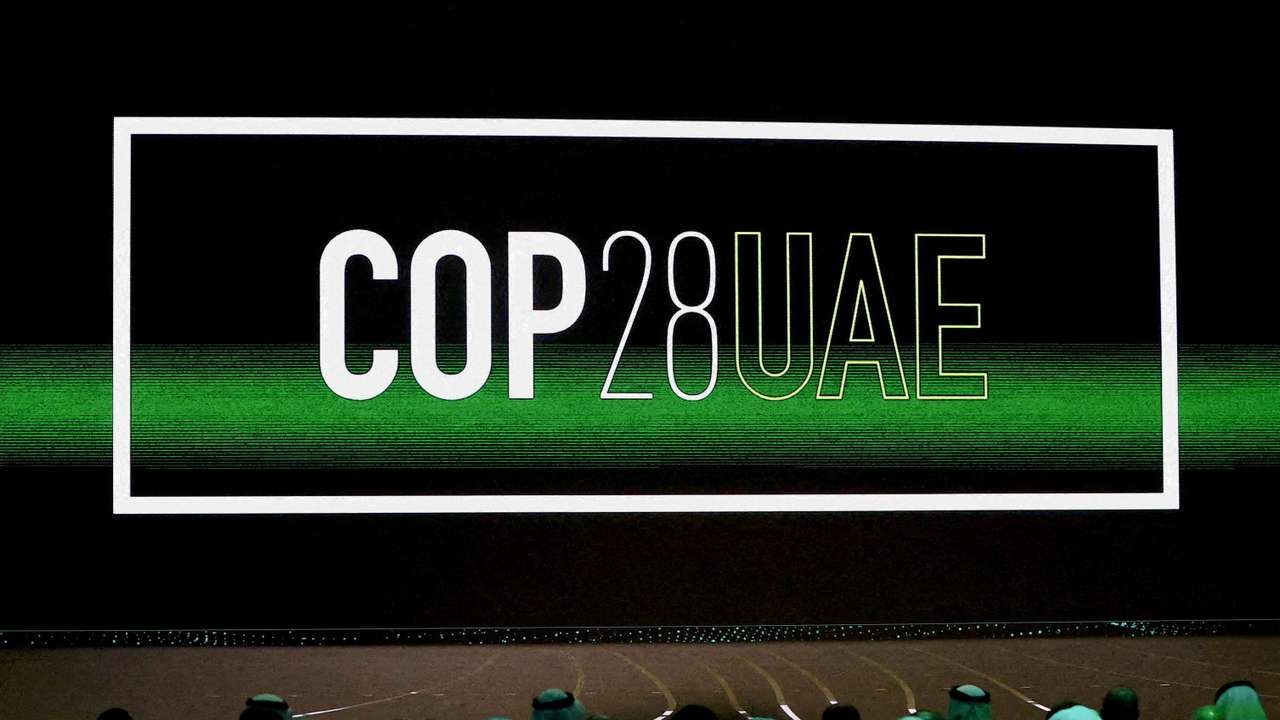 FILE PHOTO: 'Cop28 UAE' logo is displayed on the screen during the opening ceremony of Abu Dhabi Sustainability Week (ADSW) under the theme of 'United on Climate Action Toward COP28', in Abu Dhabi