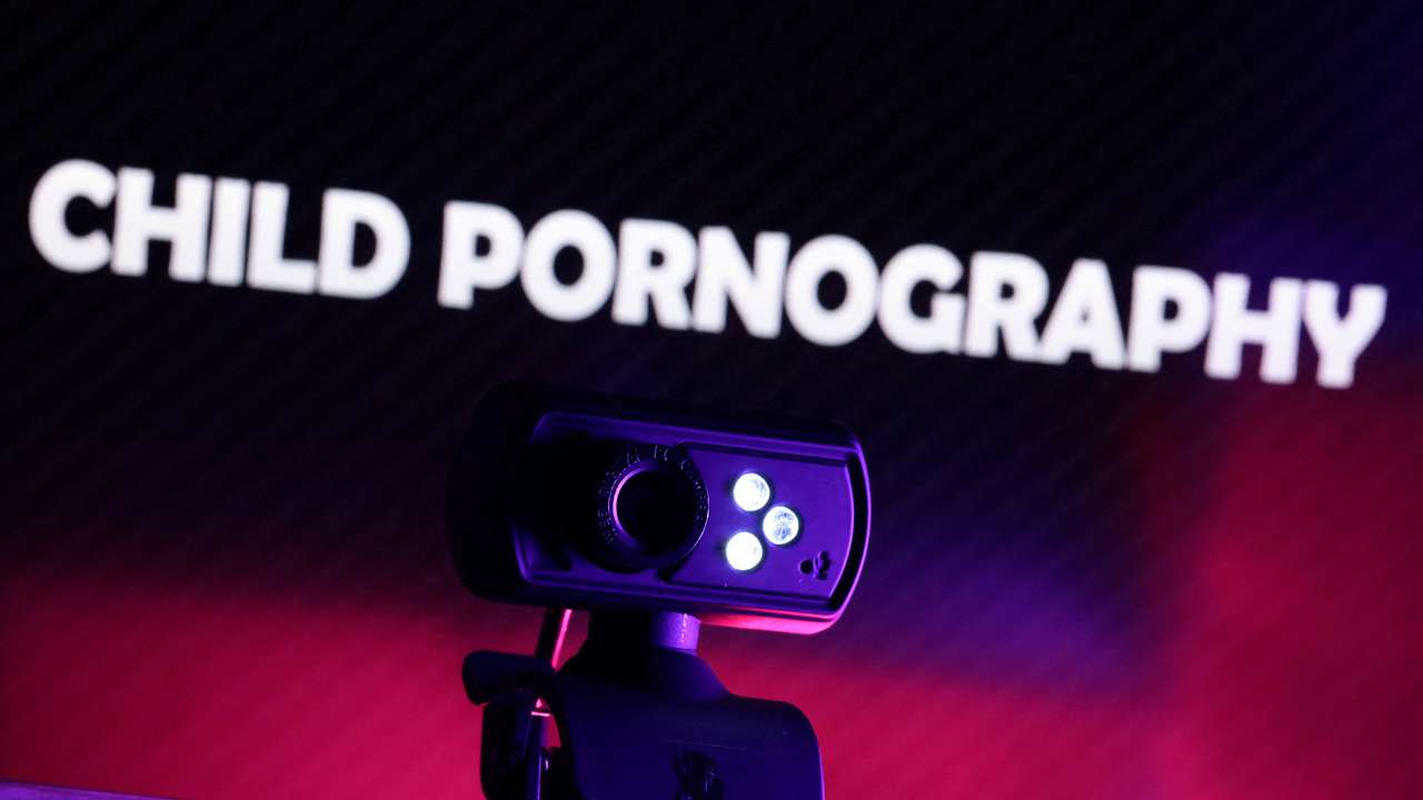 Illustration shows a web camera and displayed words "Child Pornography\