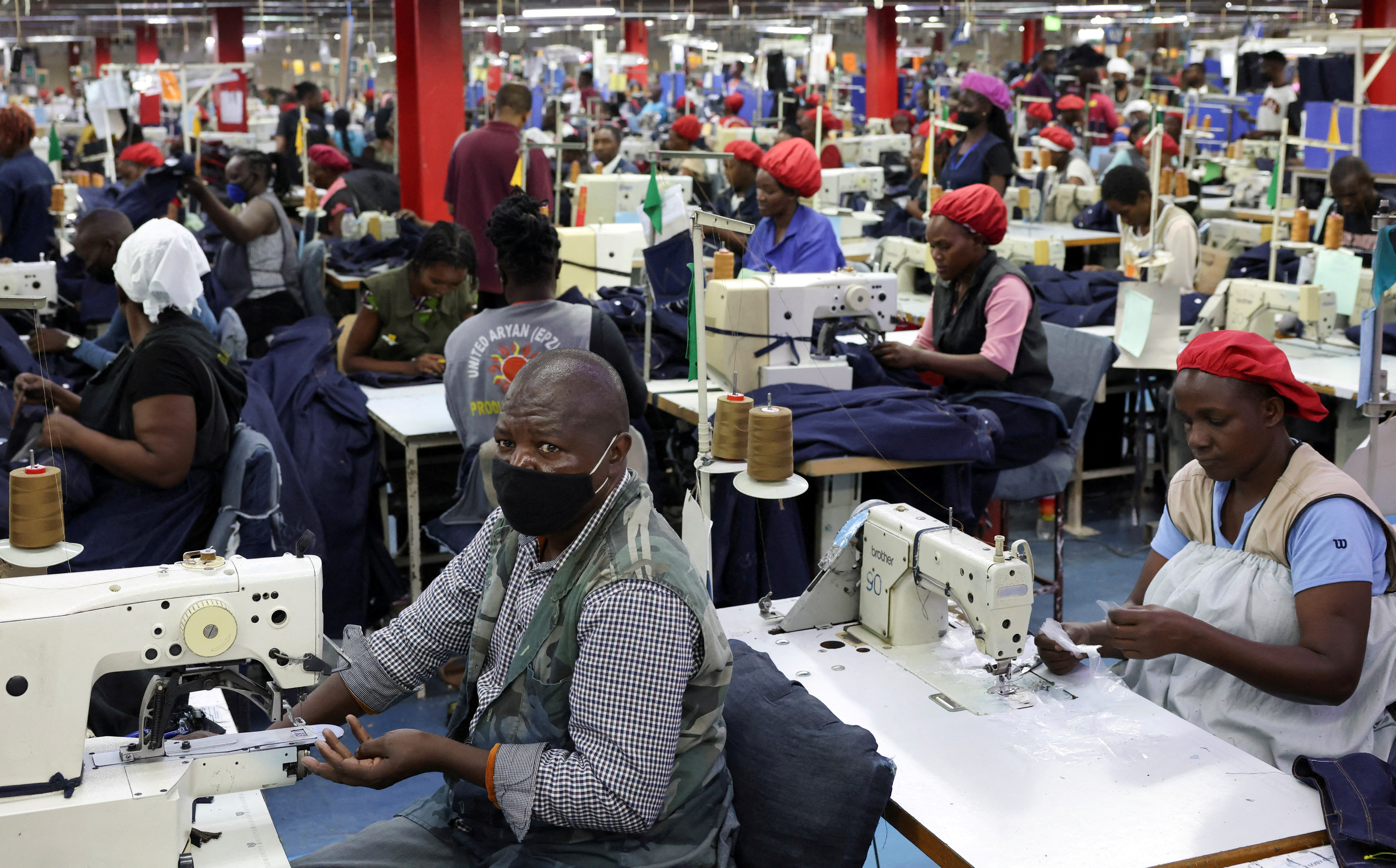 FILE PHOTO: Kenyan workers prepare clothes for export at the United Aryan EPZ factory in Ruaraka district of Nairobi