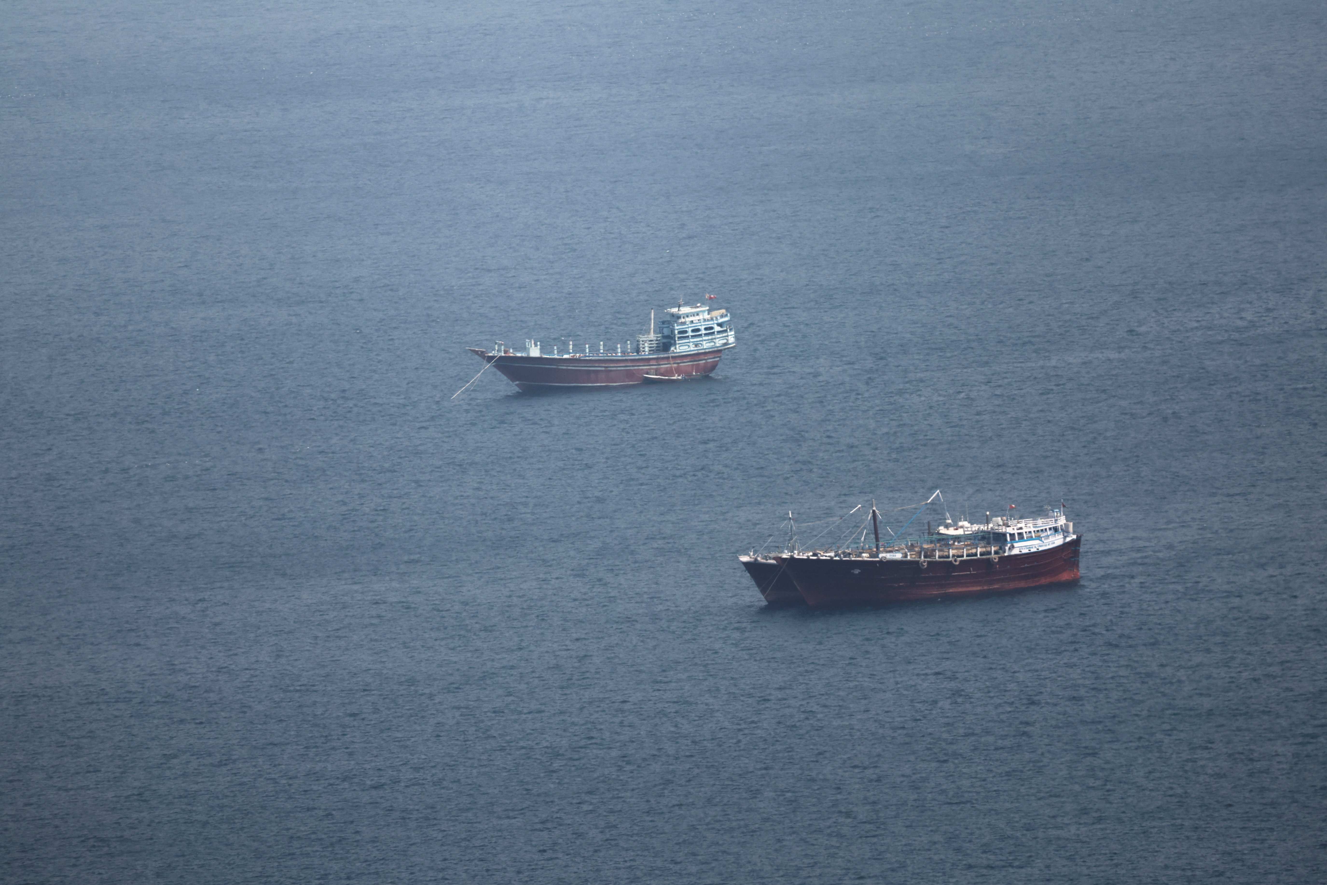 Boats in the Strait of Hormuz amid the U.S.-Israeli conflict with Iran, as seen from Musandam