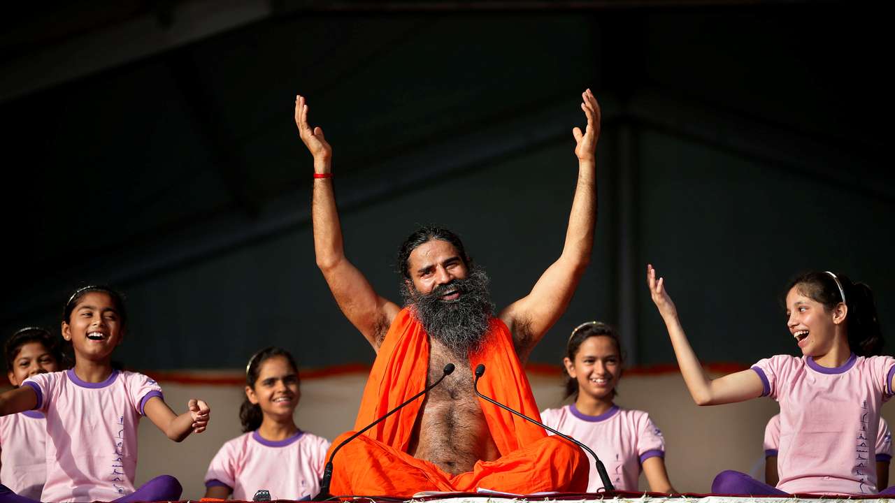 Yoga guru Ramdev performs yoga ahead of IYD in Ahmedabad