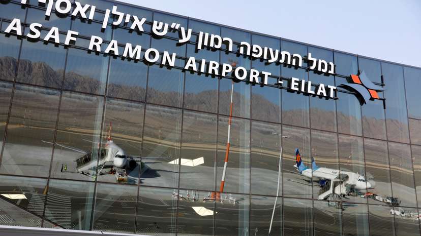 Planes are reflected in the facade of the Ramon International Airport after an inauguration ceremony for the new airport, just outside the southern Red Sea resort city of Eilat, Israel