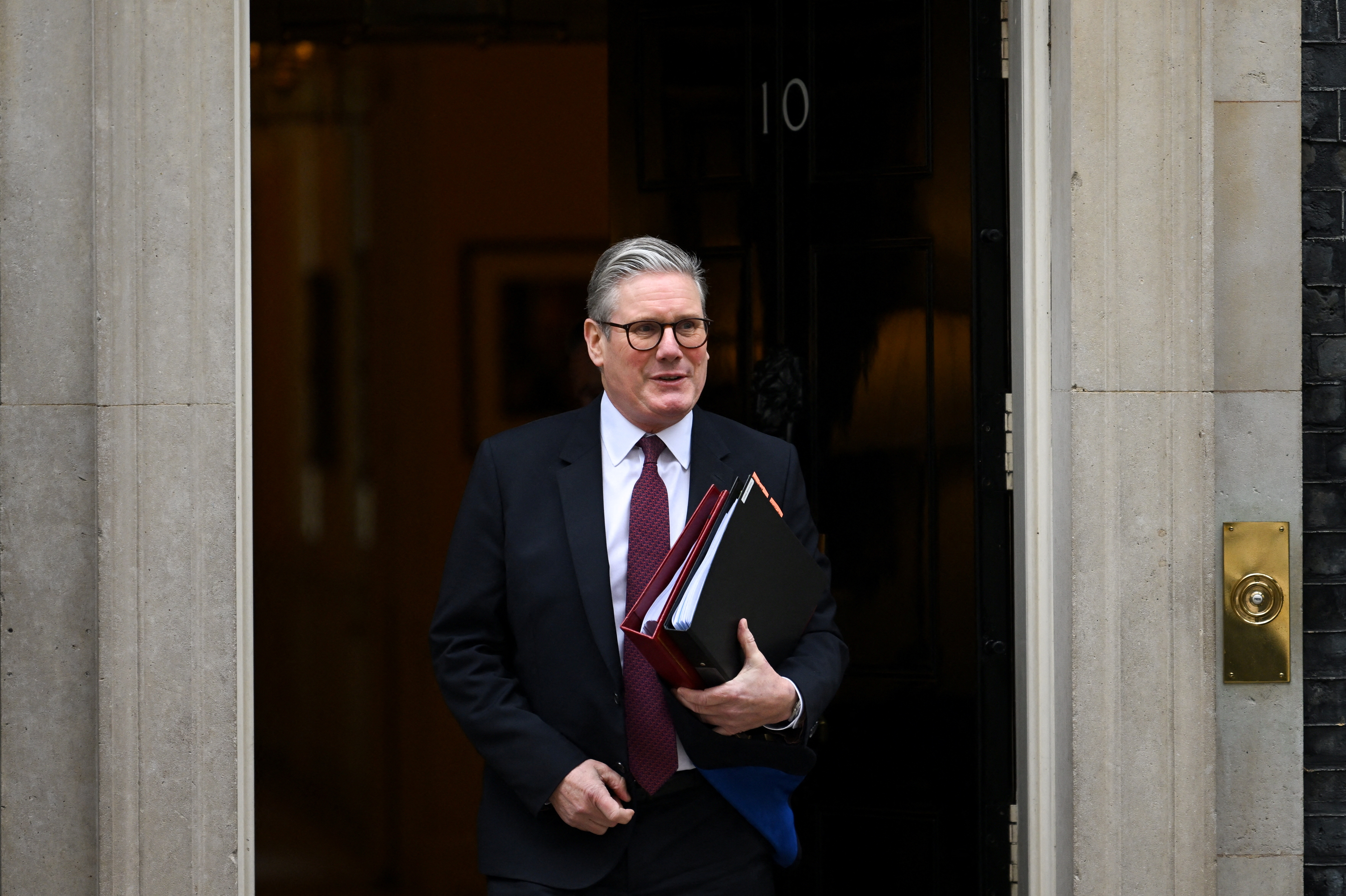 British Prime Minister Keir Starmer walks on Downing Street