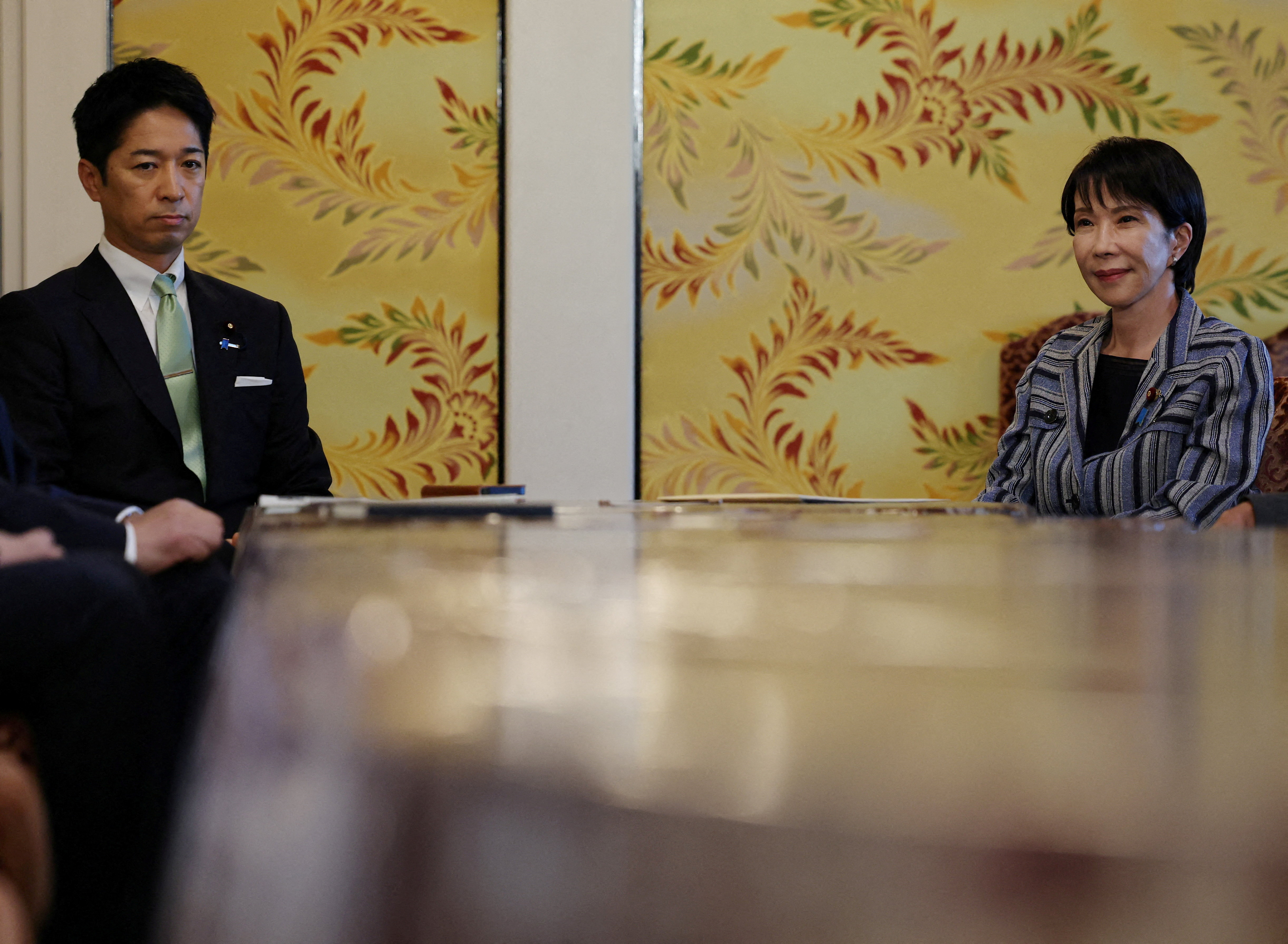 FILE PHOTO: Leader of Japan's ruling Liberal Democratic Party (LDP) Sanae Takaichi meets Japan Innovation Party's co-leader Fumitake Fujita at Japan's National Diet Building, in Tokyo