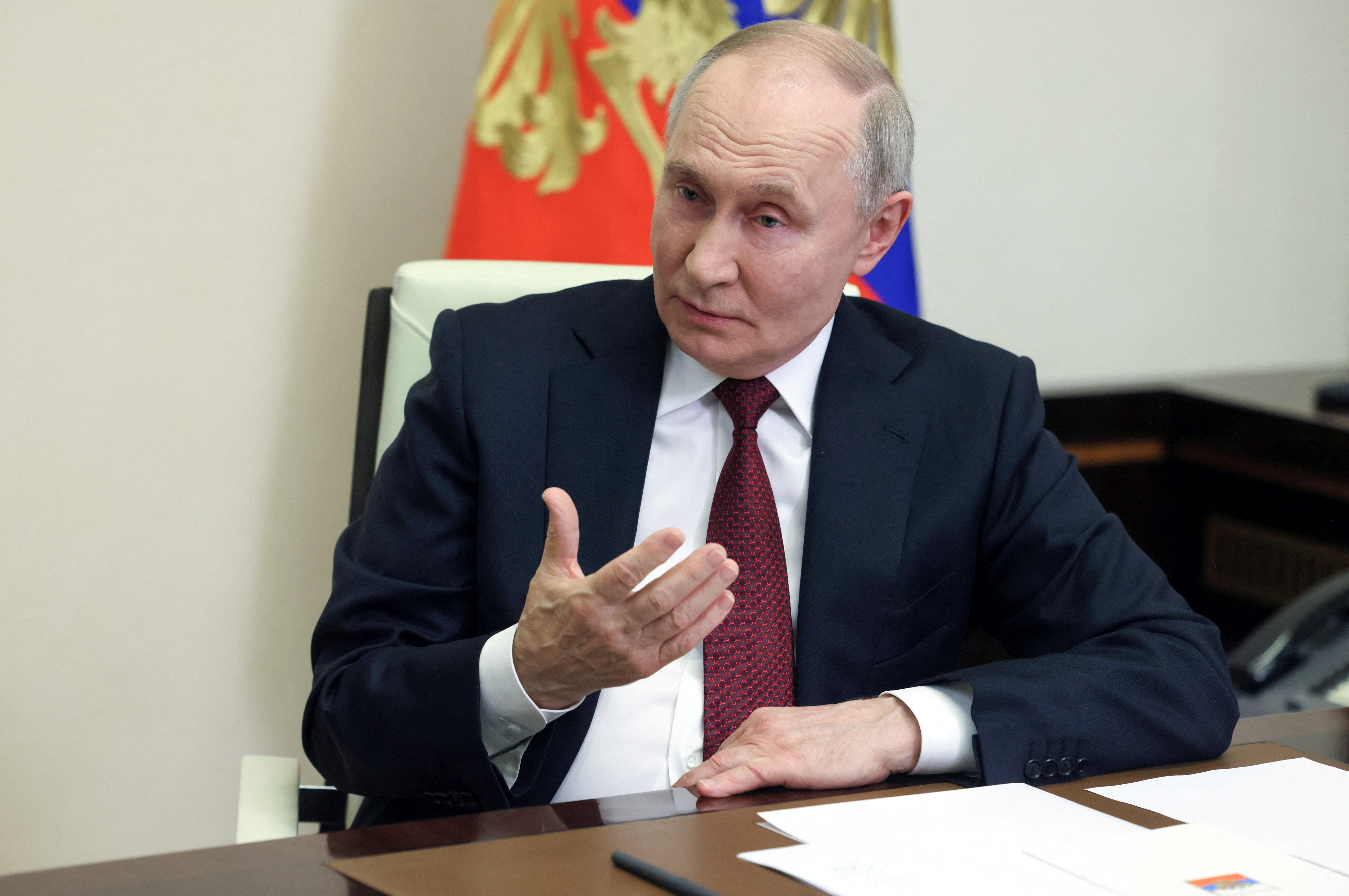 Russian President Putin speaks with correspondent Zarubin at his residence outside Moscow