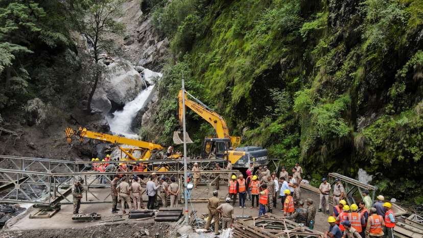 A drone view of BRO and SDRF officials attempting to build a makeshift bridge in Gangnani