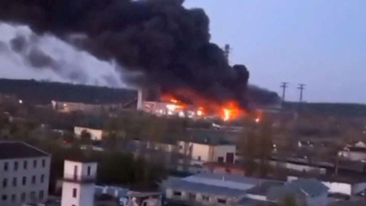 Smoke and fire rise from the site of a missile strike at the Trypilska power station in Kyiv region
