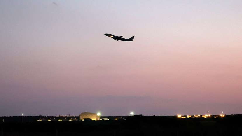 An aircraft flies near RAF Akrotiri, a British sovereign base that was hit by a drone early on Monday