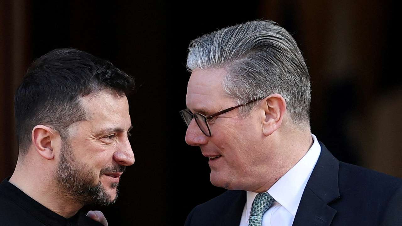 FILE PHOTO: British Prime Minister Keir Starmer greets Ukrainian President Volodymyr Zelenskiy