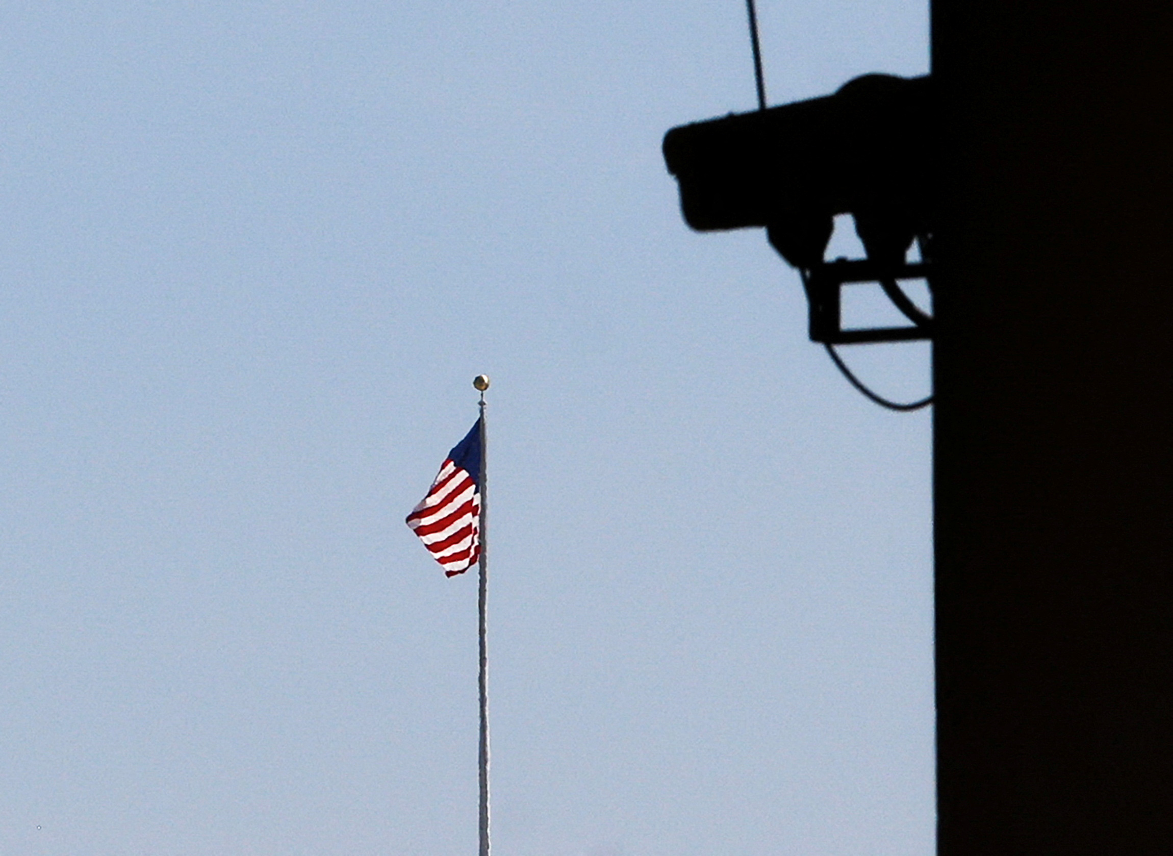 An American flag is seen from the E. Barrett Prettyman Federal Courthouse in Washington
