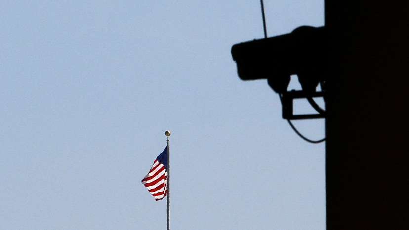 An American flag is seen from the E. Barrett Prettyman Federal Courthouse in Washington