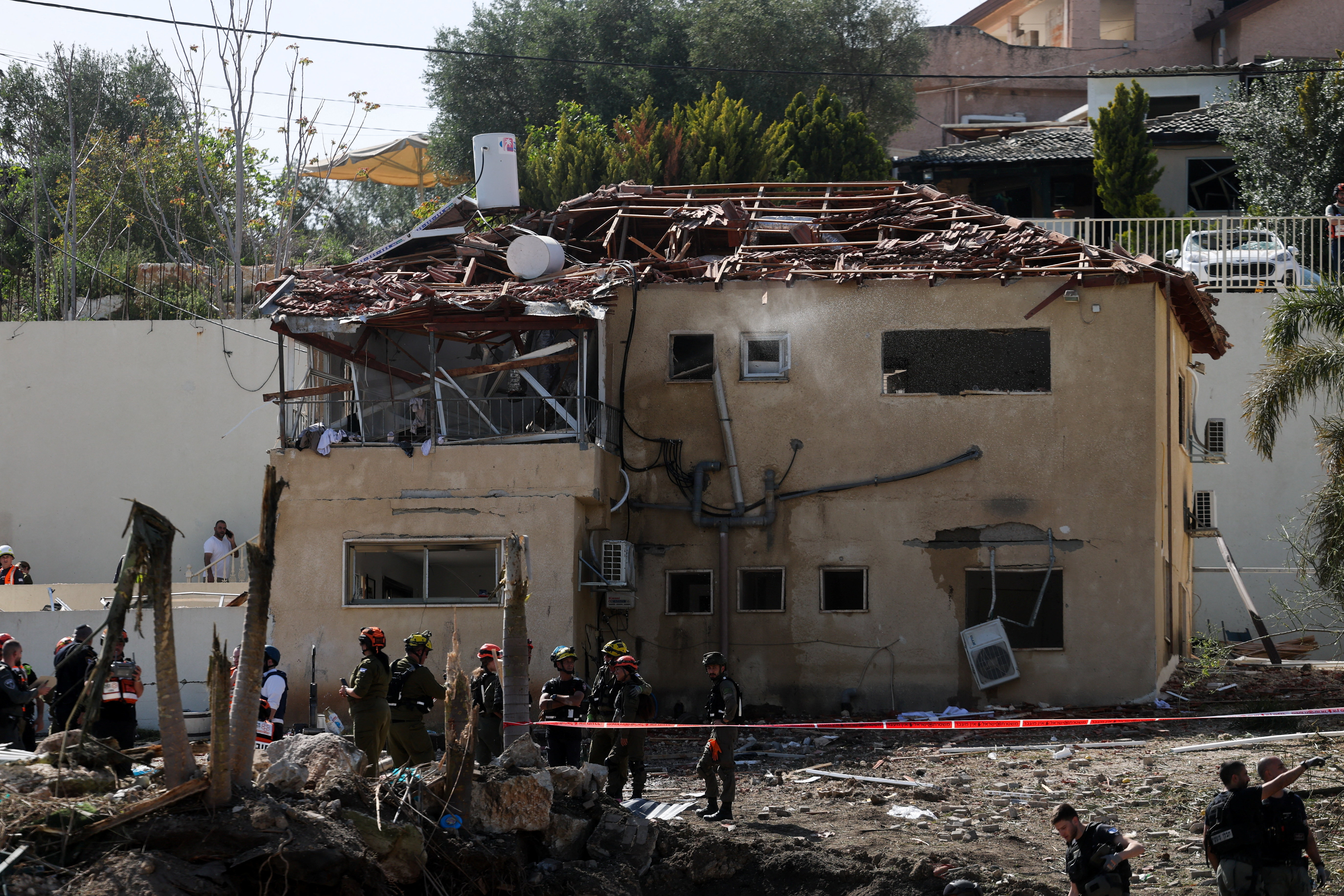 The impact site following Iranian missile barrages as the U.S.-Israeli conflict with Iran continues, in central Israel