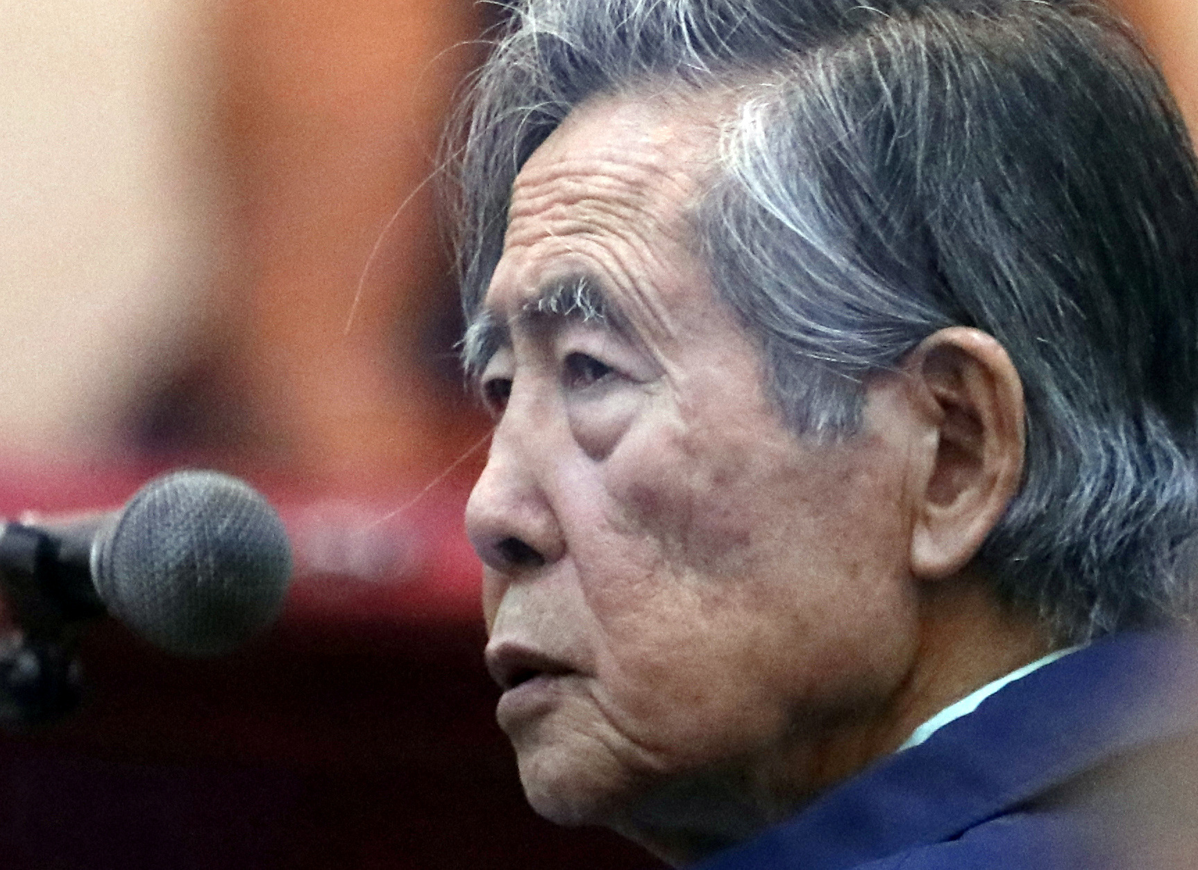 Former President of Peru Alberto Fujimori attends a trial as a witness at the navy base in Callao