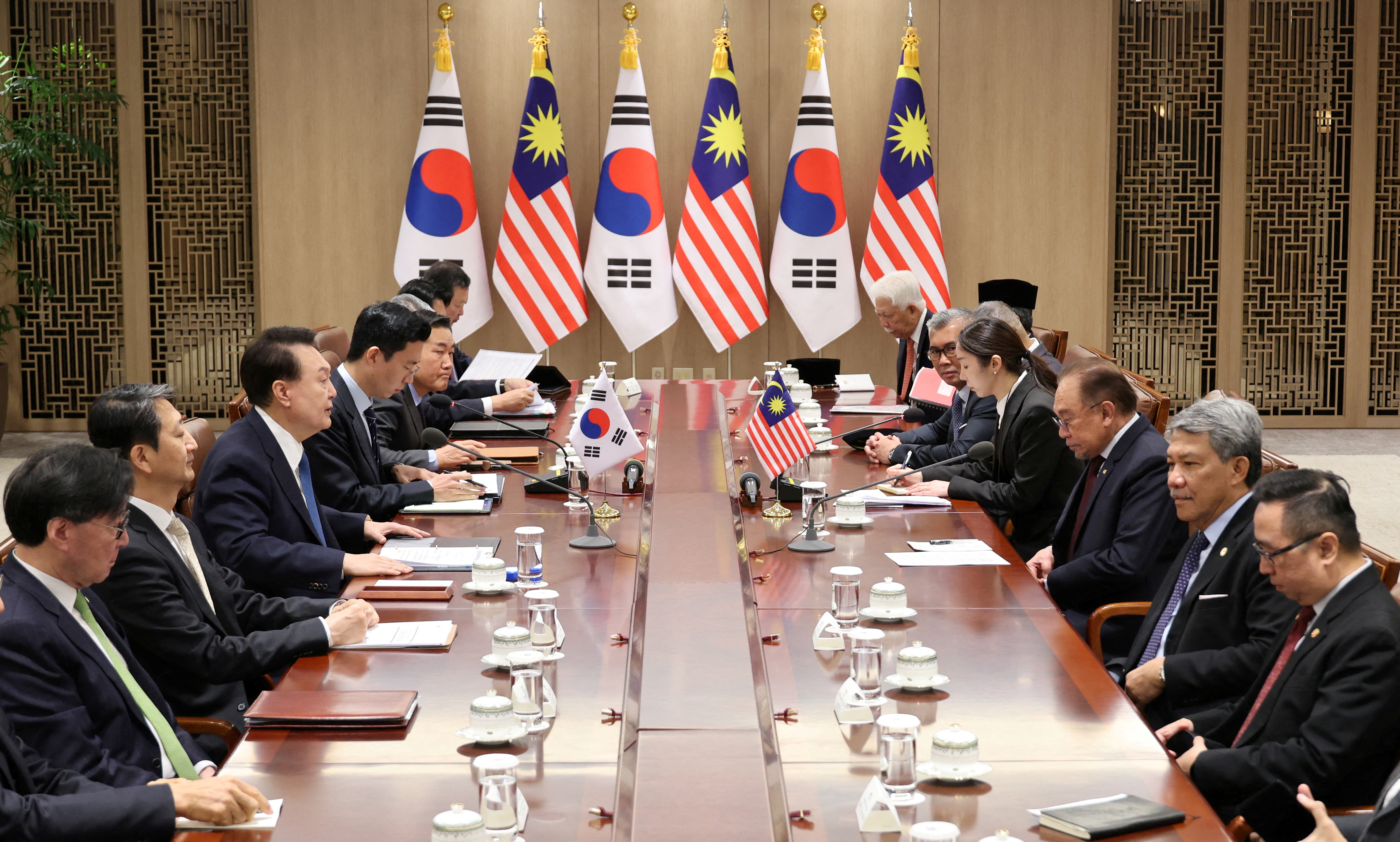 South Korean President Yoon Suk Yeol meats with Malaysian Prime Minister Anwar Ibrahim at the Presidential Office in Seoul