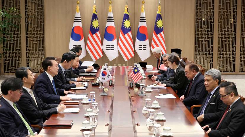 South Korean President Yoon Suk Yeol meats with Malaysian Prime Minister Anwar Ibrahim at the Presidential Office in Seoul