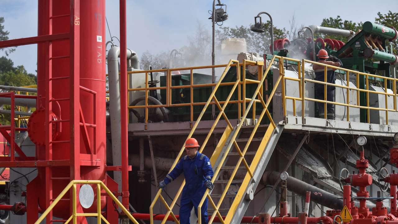 Employees work at a gas well of Ukraine's state energy company Naftogaz in Lviv region