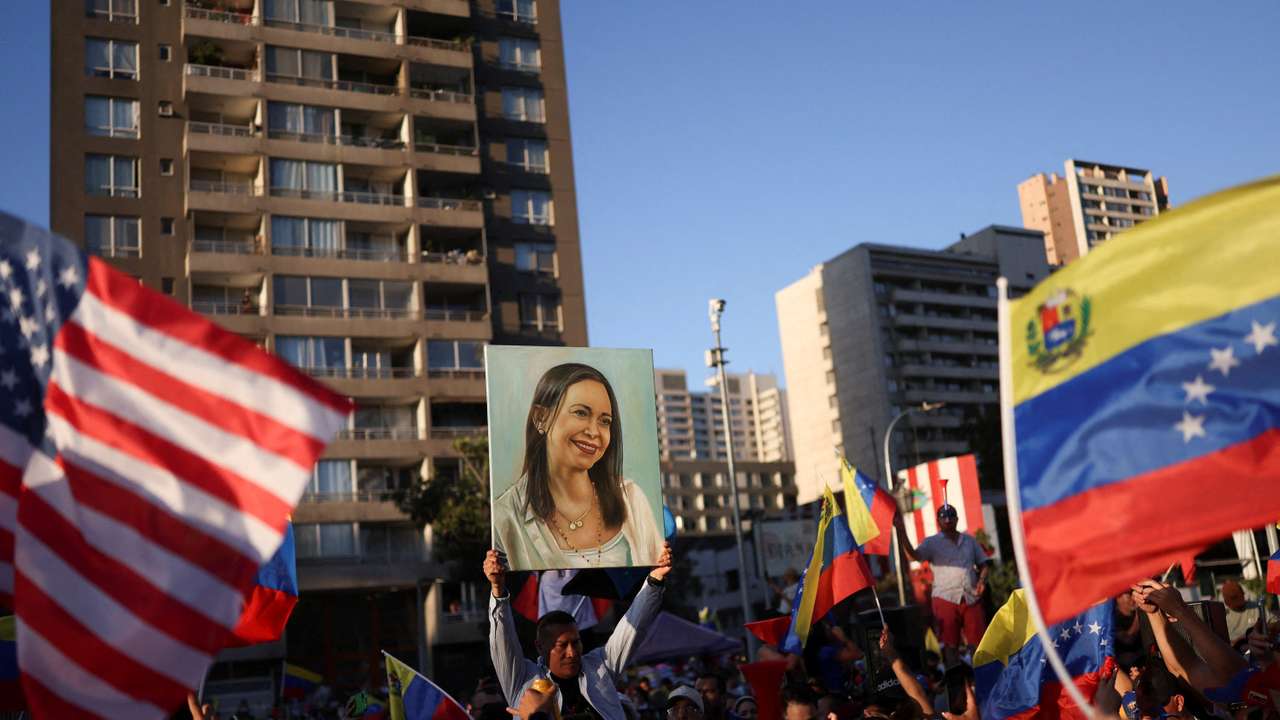People celebrate after the U.S. struck Venezuela and captured its President Nicolas Maduro and his wife Cilia Flores, in Santiago