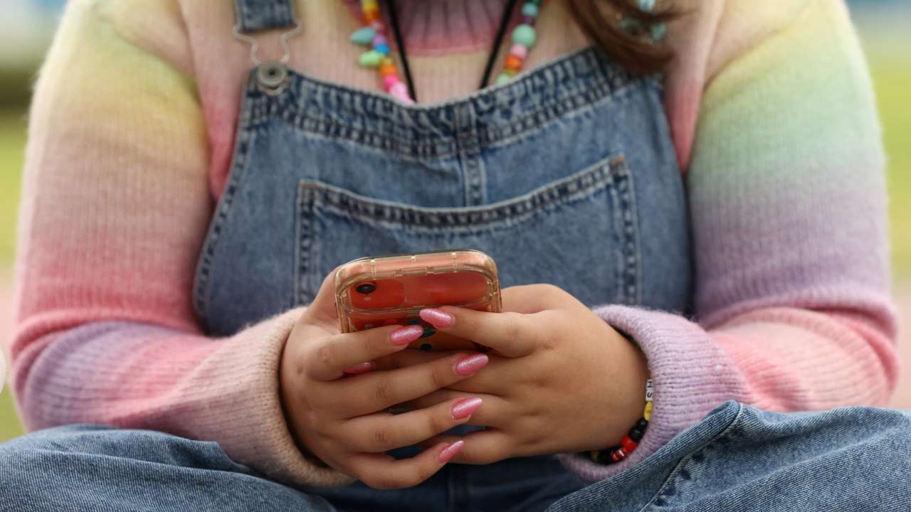 Teens discuss Australia's social media ban for under-16s, set to take effect December 10, in Sydney