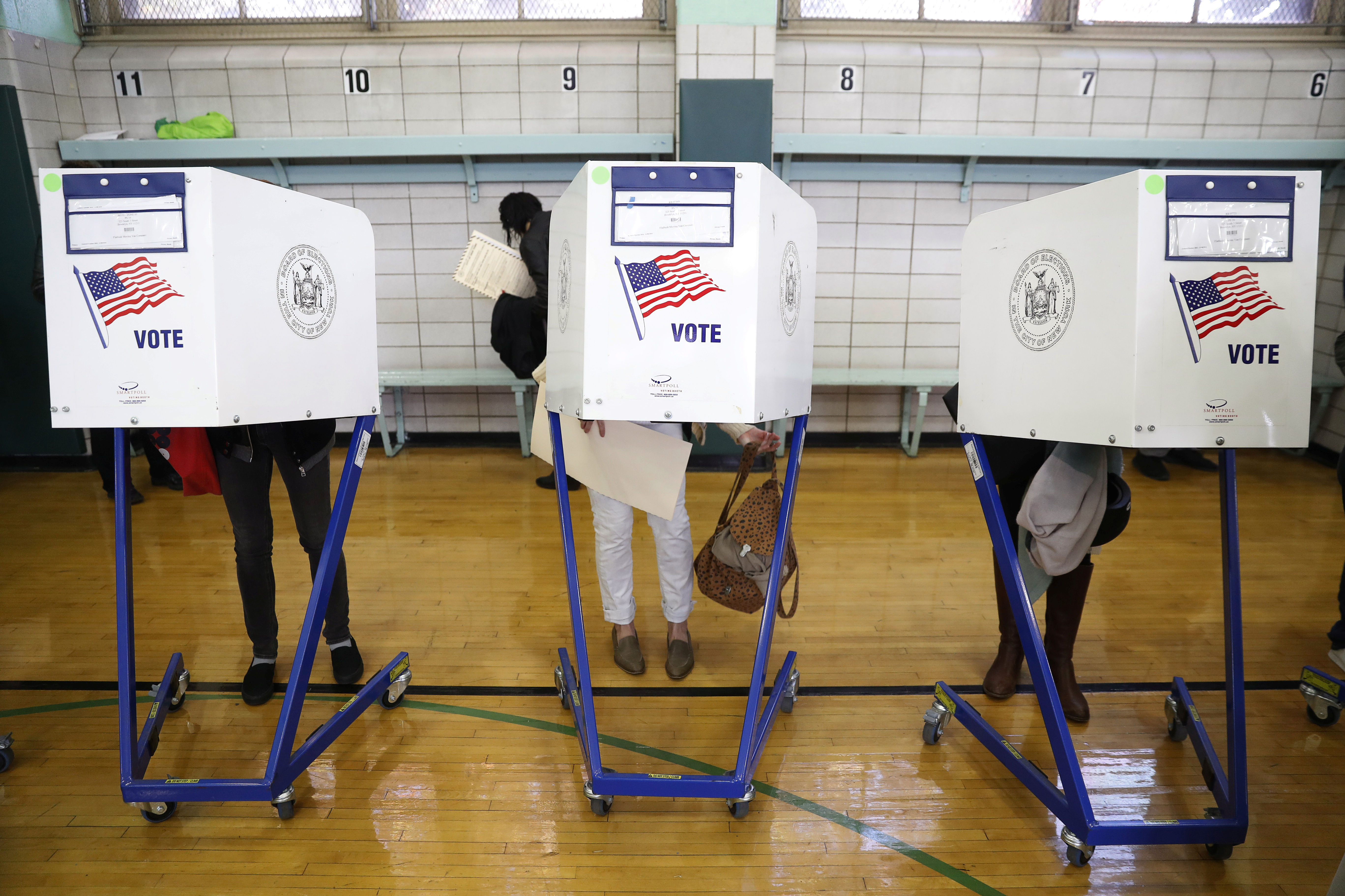 Voters fill in their ballots during voting for the U.S presidential election in the Brooklyn borough of New York