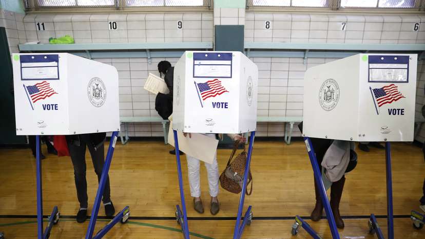 Voters fill in their ballots during voting for the U.S presidential election in the Brooklyn borough of New York