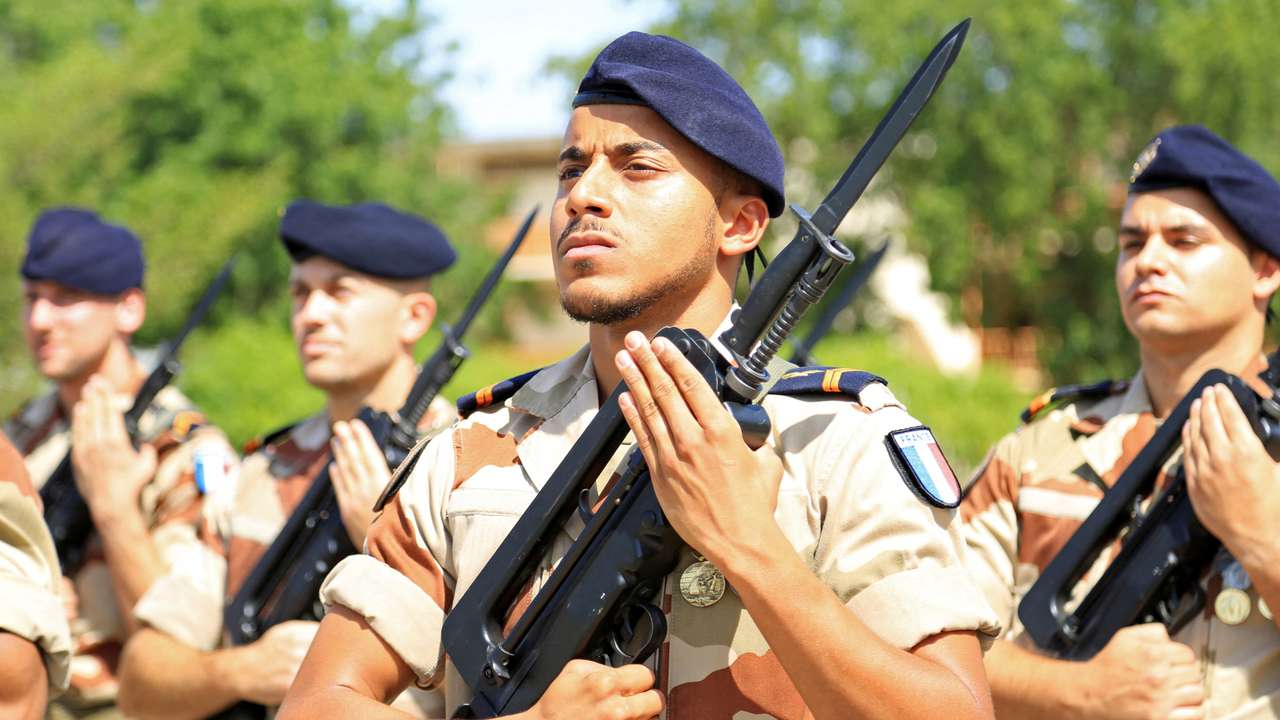 FILE PHOTO: French soldiers stand at attention during a morning drill at the French military base in Chadian capital N'Djamena