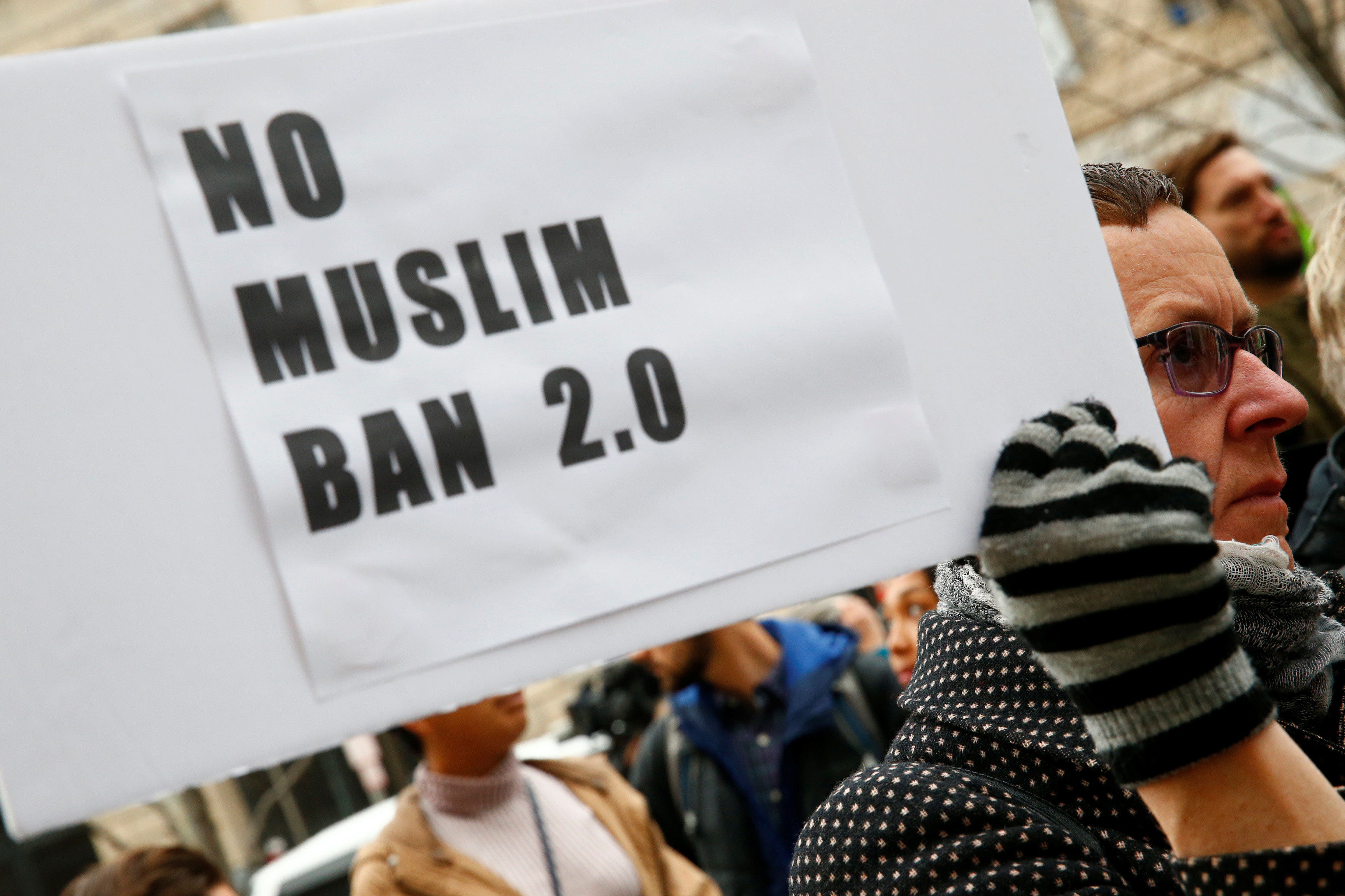 FILE PHOTO: Immigration activists rally against the Trump administration's new ban against travelers from six Muslim-majority nations, in Washington