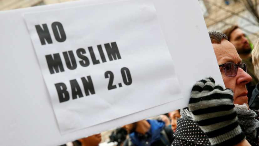 FILE PHOTO: Immigration activists rally against the Trump administration's new ban against travelers from six Muslim-majority nations, in Washington