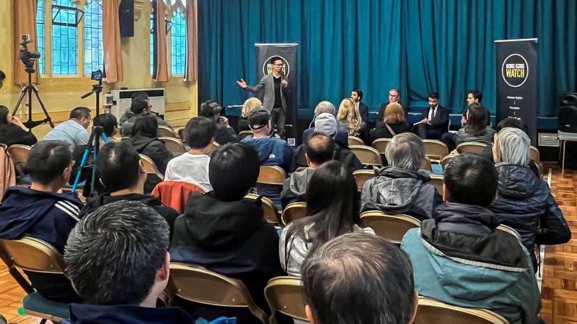 People participate in a hustings event focussed on the Hong Kong community, in Sutton
