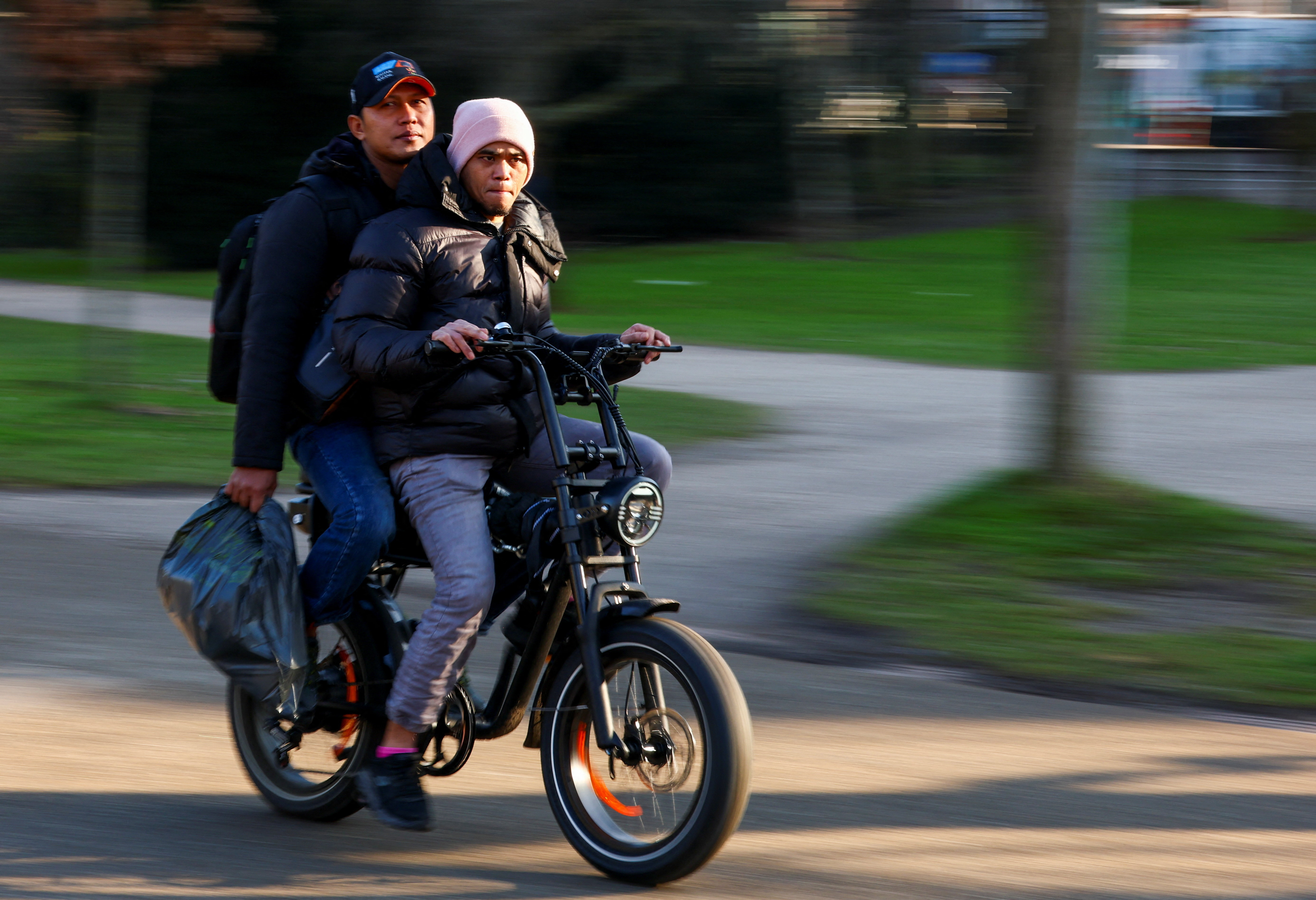 A person drives a fatbike in Vondelpark while the city of Amsterdam is preparing to ban trendy "fat bikes" from busy areas