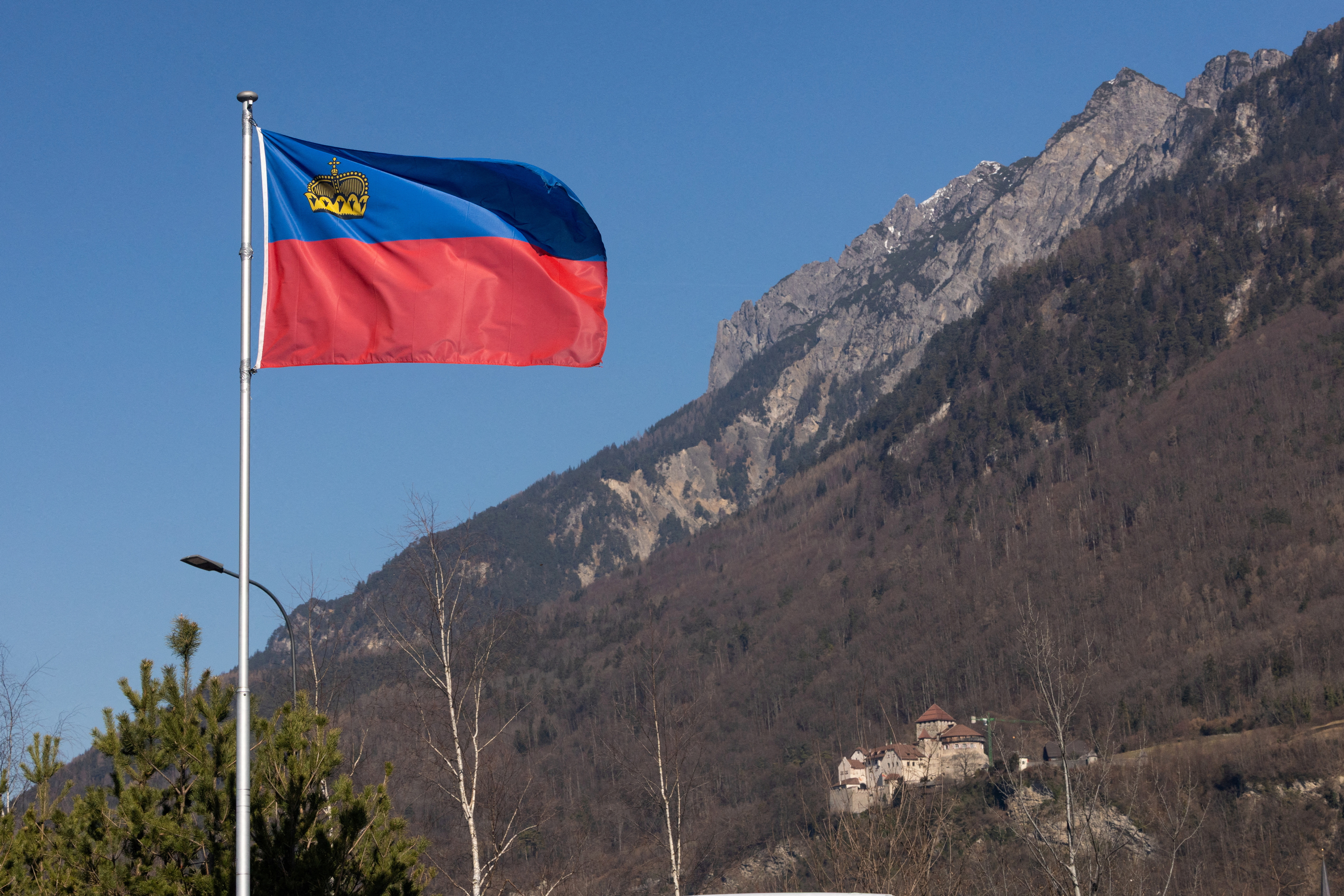 A flag of the Principality of Liechtenstein is seen near Vaduz