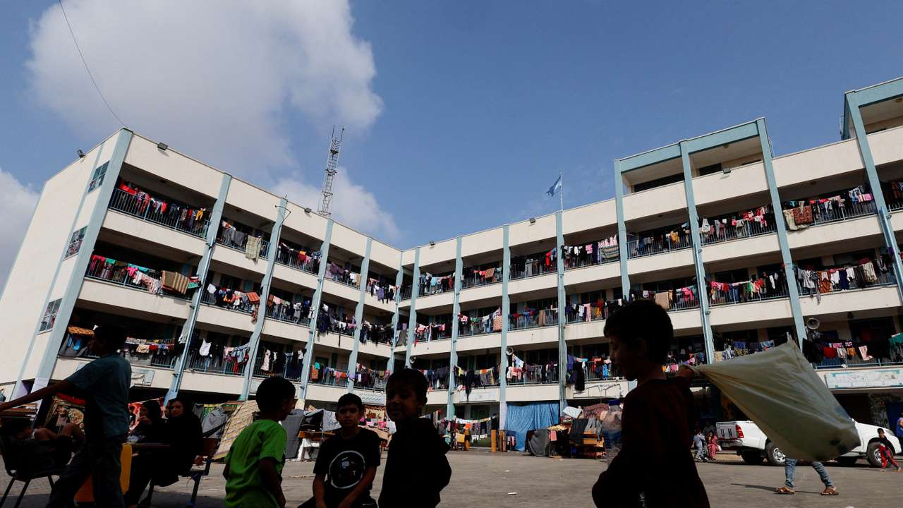 Palestinians receive aid distributed by the United Nations, in Khan Younis