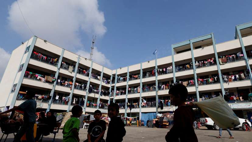 Palestinians receive aid distributed by the United Nations, in Khan Younis