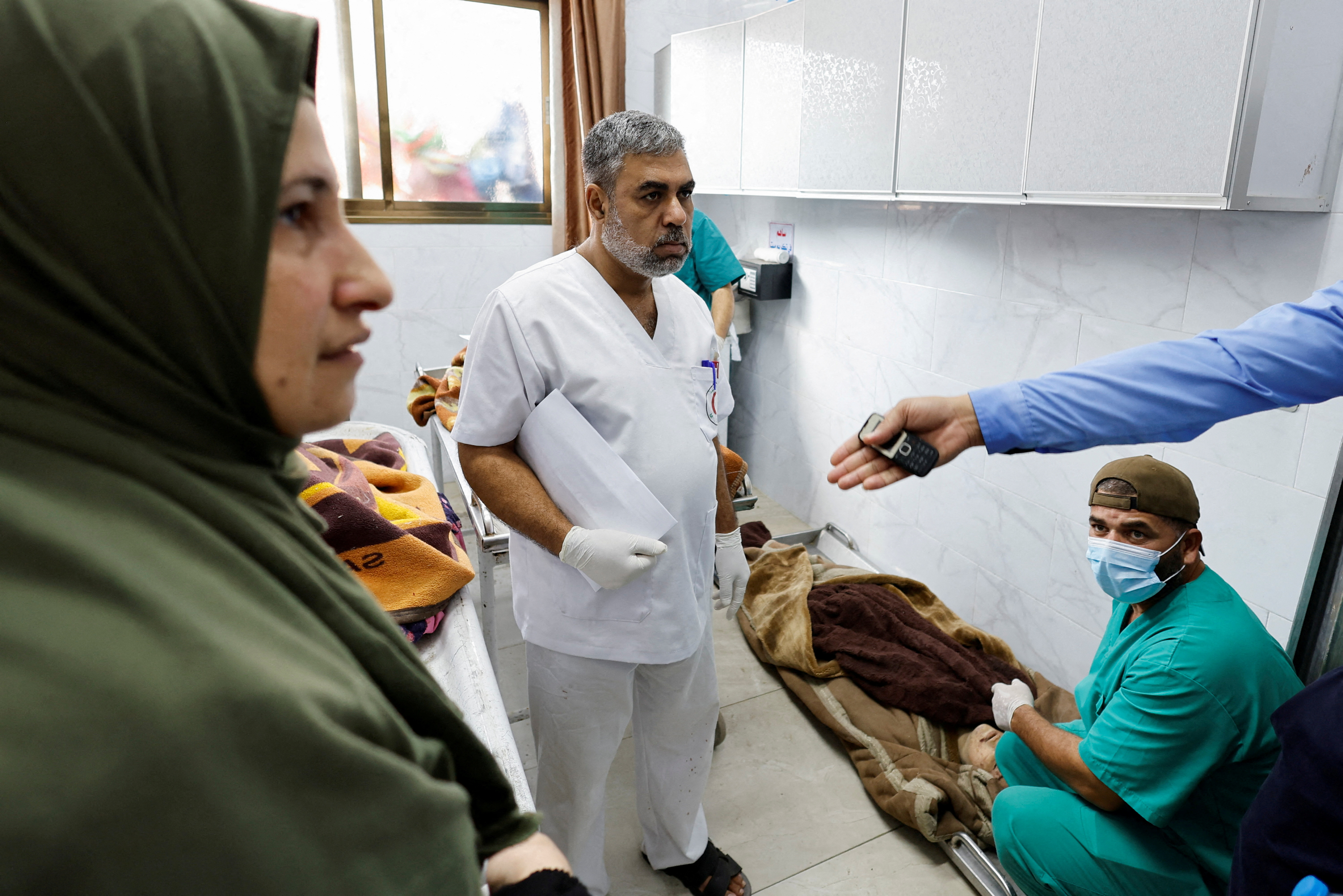 FILE PHOTO: Saeed Al-Shorbaji, the supervisor of Nasser hospital's morgue, looks on as he works at the morgue, in the southern Gaza Strip