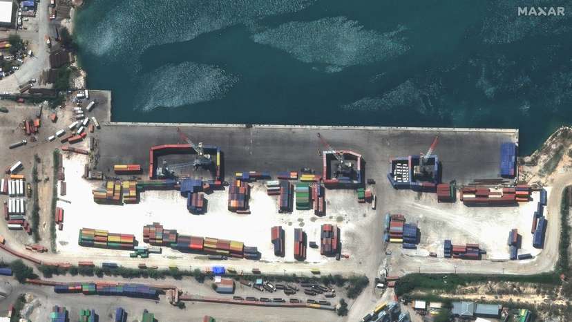 A satellite image shows shipping containers used to block access to heavy cranes, in Port-au-Prince