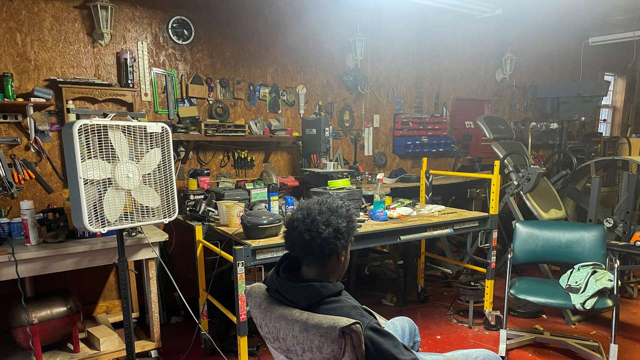 Abdur Rahim Jabbar, half-brother of the Texas truck attack accused, sits in the garage of their house in Beaumont