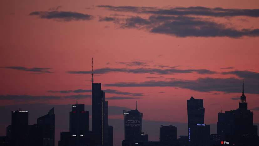 Skyline of skyscrapers is seen after sunset in Warsaw