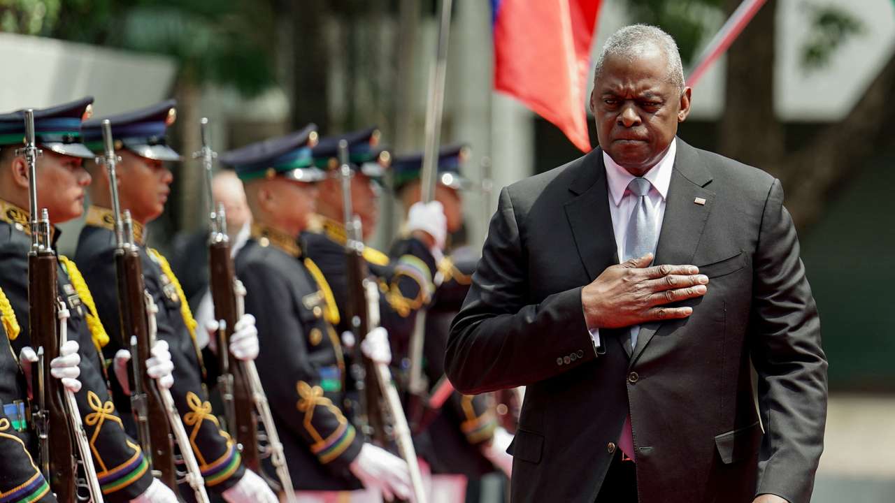 U.S. Secretary of Defense Lloyd Austin inspects honor guards during his arrival at Camp Aguinaldo, in Quezon City
